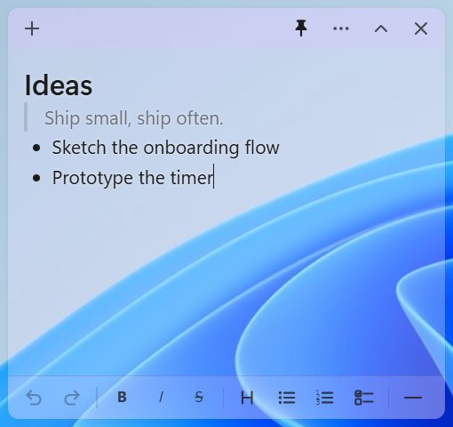 Une note translucide laissant apparaître le fond d'écran de Windows 11 derrière elle
