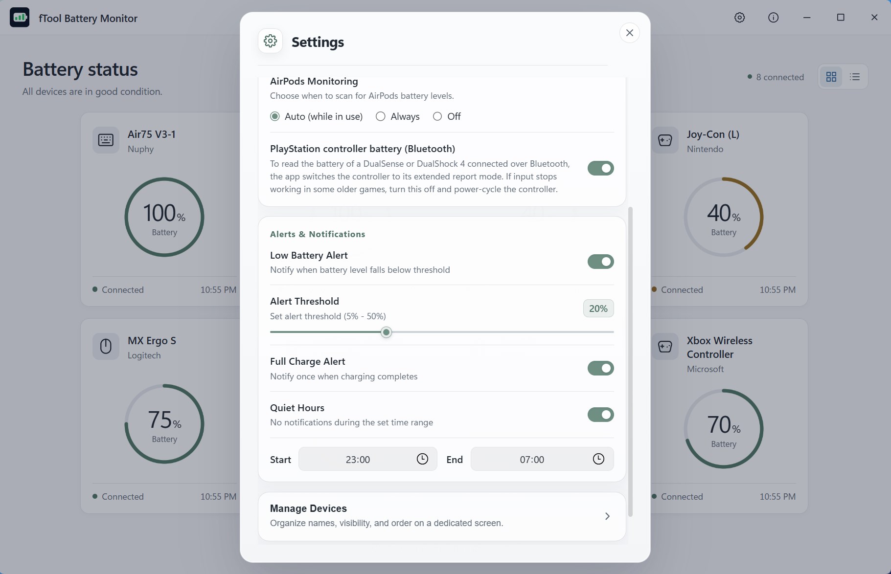 The settings dialog with the low-battery alert, the threshold slider, the full-charge alert and quiet hours from 23:00 to 07:00
